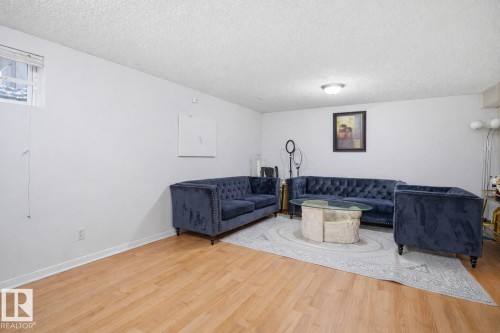 Living space featuring light wood floors and white walls - 4619 202 Street, Edmonton, AB - Indoor Photo Showing Other Room