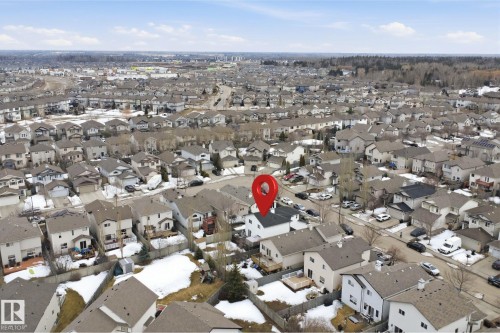 Aerial view of the property and surrounding neighborhood, featuring residential homes with sloped roofs and driveways - 4619 202 Street, Edmonton, AB - Outdoor With View