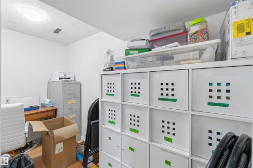 The room features light-colored walls and a ceiling light fixture - 4023 86 Street Nw, Edmonton, AB - Indoor