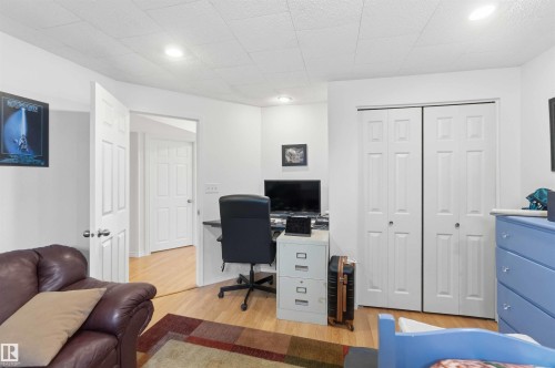 This room features light wood flooring, white walls, and a white ceiling - 4023 86 Street Nw, Edmonton, AB - Indoor