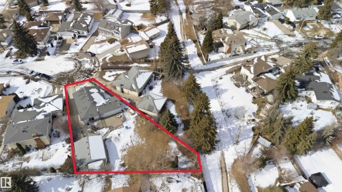 Aerial view showcasing the property's lot, featuring a main residence with a gray roof and a detached structure - 4023 86 Street Nw, Edmonton, AB -  With View
