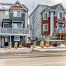The property features a two-story exterior with a balcony, a front entry door, and visible windows - 138 655 Tamarack Road Nw, Edmonton, AB  - Outdoor With Facade 