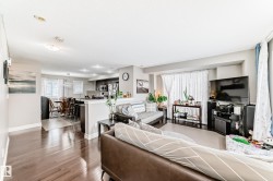 The property features an open-concept layout with hardwood floors throughout the main living areas - 