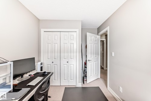This room features light-colored walls, white baseboards, and a neutral carpet - 138 655 Tamarack Road Nw, Edmonton, AB - Indoor