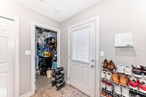 Entryway featuring light-colored walls and tiled flooring - 138 655 Tamarack Road Nw, Edmonton, AB - Indoor Photo Showing Other Room