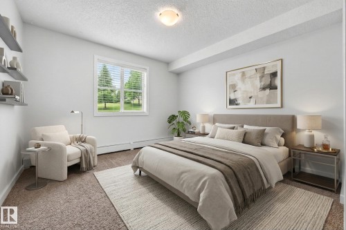 This bedroom features a window with blinds, light-colored walls, and carpeting - 301 1070 Mcconachie Boulevard, Edmonton, AB - Indoor Photo Showing Bedroom
