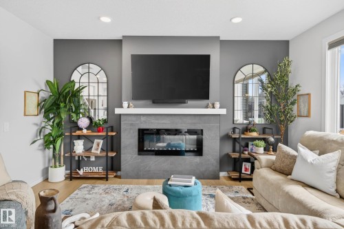 139 Stonehouse Way, Leduc, AB - Indoor Photo Showing Living Room With Fireplace