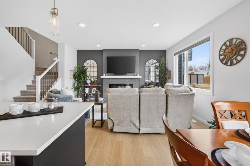 139 Stonehouse Way, Leduc, AB - Indoor Photo Showing Living Room With Fireplace