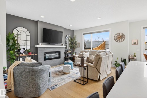 139 Stonehouse Way, Leduc, AB - Indoor Photo Showing Living Room With Fireplace