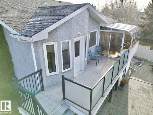 The property features an exterior with textured siding and a shingled roof - 3772 30 Street, Edmonton, AB - Outdoor With Exterior