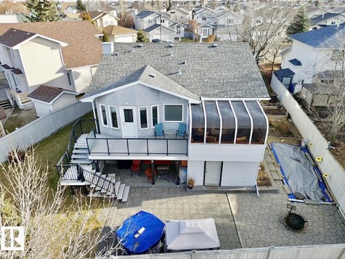 This property features a spacious backyard with a paved patio area and a fire pit - 3772 30 Street, Edmonton, AB - Outdoor