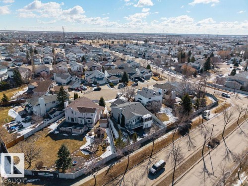 This aerial view showcases a residential neighborhood with several properties featuring fenced yards - 3772 30 Street, Edmonton, AB - Outdoor With View