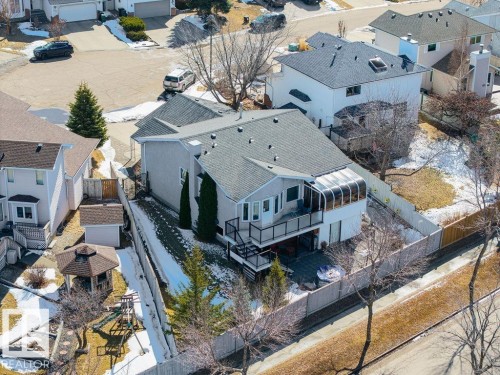 The property features a multi-level deck, an enclosed sunroom, and a fenced yard - 3772 30 Street, Edmonton, AB - Outdoor With Deck Patio Veranda