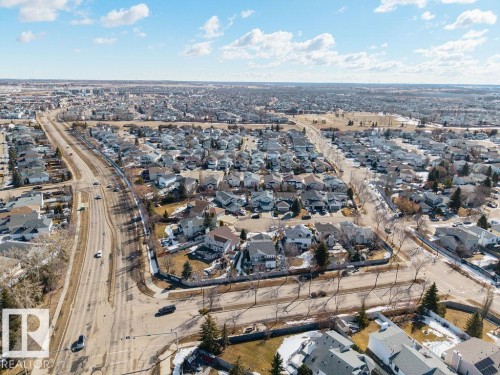 Aerial view showcasing a residential area with numerous detached properties and a multi-lane roadway - 3772 30 Street, Edmonton, AB - Outdoor With View