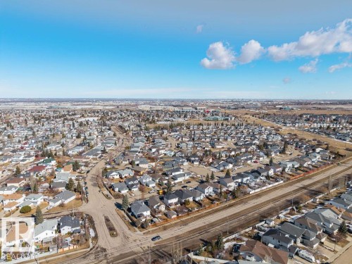 An aerial view showcasing a residential area with a clear blue sky - 3772 30 Street, Edmonton, AB - Outdoor With View