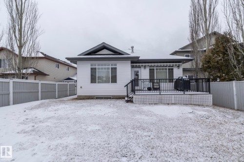 The property features a private fenced yard with a deck - 307 Ravine Close, Devon, AB - Outdoor