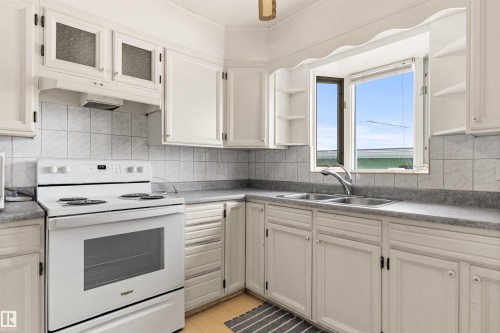 3211 70 Street, Edmonton, AB - Indoor Photo Showing Kitchen With Double Sink