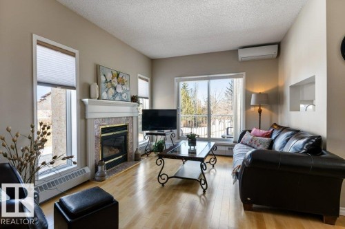 203 15499 Castle Downs Road, Edmonton, AB - Indoor Photo Showing Living Room With Fireplace