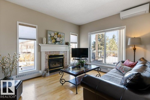 203 15499 Castle Downs Road, Edmonton, AB - Indoor Photo Showing Living Room With Fireplace