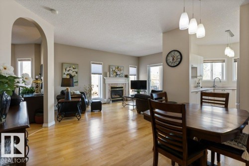 203 15499 Castle Downs Road, Edmonton, AB - Indoor Photo Showing Dining Room With Fireplace