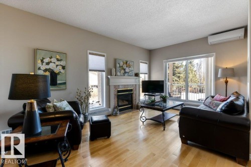 203 15499 Castle Downs Road, Edmonton, AB - Indoor Photo Showing Living Room With Fireplace