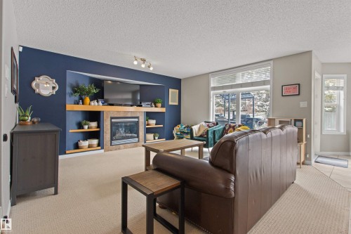 607 77 Street, Edmonton, AB - Indoor Photo Showing Living Room With Fireplace