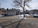 The property features a concrete driveway leading to an attached garage - 65 Coloniale Way, Beaumont, AB  - Outdoor With Facade 