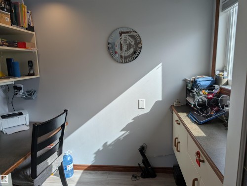 The room features light gray walls, a window providing natural light, and light-colored flooring - 65 Coloniale Way, Beaumont, AB - Indoor Photo Showing Other Room