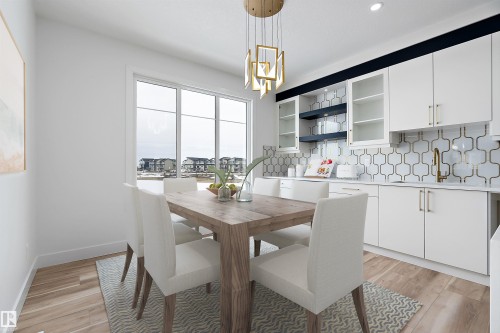 This dining area features large windows, wood-look flooring, a modern light fixture, and a built-in cabinet unit with glass-fronted cabinets and a patterned backsplash - 219 Crystal Creek Dr, Leduc, AB - Indoor Photo Showing Dining Room