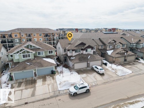 Aerial view of the property, showcasing its attached garage and proximity to other residential structures - 7873 170A Avenue, Edmonton, AB - Outdoor With Facade
