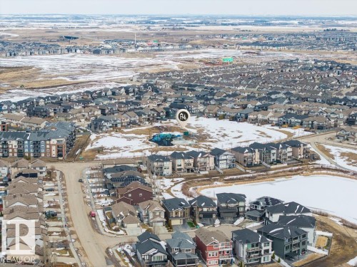 Aerial view of the surrounding neighborhood featuring residential properties and a visible pond - 7873 170A Avenue, Edmonton, AB - Outdoor With View