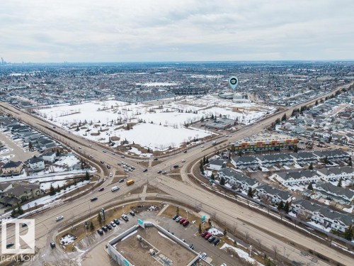 Expansive aerial perspective showcasing a residential development with diverse housing styles - 7873 170A Avenue, Edmonton, AB - Outdoor With View