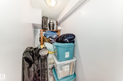 Utility storage area with a ceiling light fixture - 7512 136 Avenue, Edmonton, AB - Indoor Photo Showing Other Room