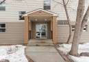 The property features a welcoming covered entrance with a concrete walkway and steps - 103 12110 119 Ave, Edmonton, AB  - Outdoor With Exterior 