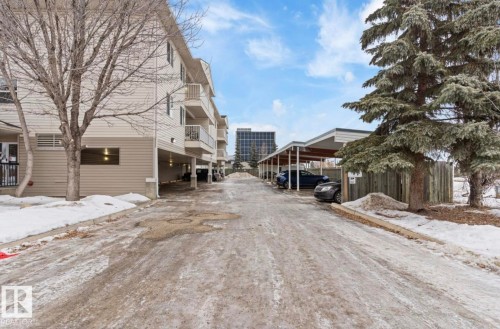 The property features covered parking spaces and an exterior with balconies - 103 12110 119 Ave, Edmonton, AB - Outdoor