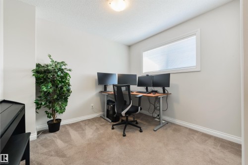 Versatile room featuring light grey walls, white baseboards, and a window with white blinds - 67 12050 17 Avenue, Edmonton, AB - Indoor Photo Showing Office