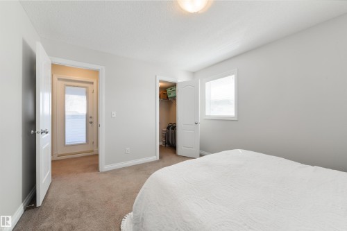 This room features light-colored walls and soft carpeting - 67 12050 17 Avenue, Edmonton, AB - Indoor Photo Showing Bedroom