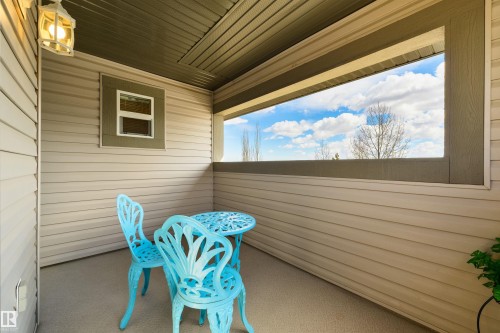 Covered patio area with siding walls and a window feature - 67 12050 17 Avenue, Edmonton, AB - Outdoor With Deck Patio Veranda With Exterior