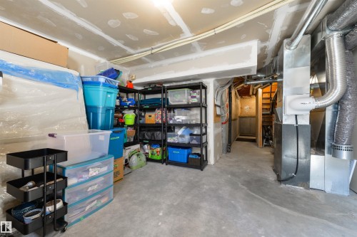 The property features an unfinished basement with exposed ductwork and utility systems - 67 12050 17 Avenue, Edmonton, AB - Indoor