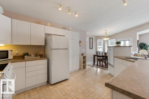 7605 165A Avenue, Edmonton, AB - Indoor Photo Showing Kitchen With Double Sink