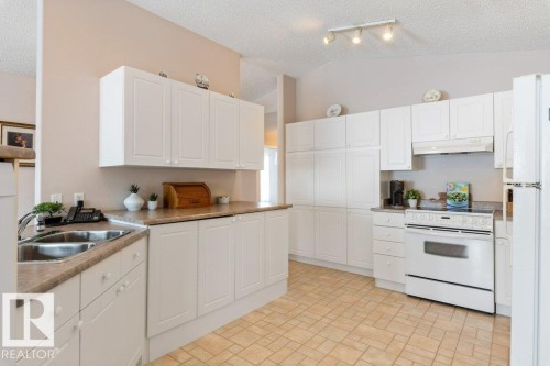 7605 165A Avenue, Edmonton, AB - Indoor Photo Showing Kitchen With Double Sink