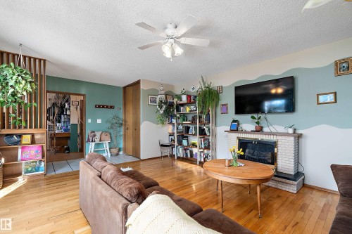 4710 54 Avenue, Wetaskiwin, AB - Indoor Photo Showing Living Room With Fireplace