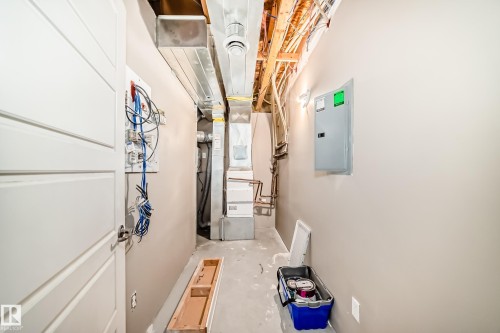 The property features a utility area with visible ductwork, electrical wiring, and a circuit breaker panel - 44 13825 155 Avenue, Edmonton, AB - Indoor