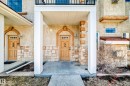 The property features a stucco exterior with stone accents and a covered entryway - 44 13825 155 Avenue, Edmonton, AB  - Outdoor 