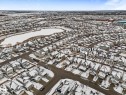 Aerial view of the property and its surrounding neighborhood, showcasing a nearby body of water - 13 Spring Link, Spruce Grove, AB  - Outdoor With View 