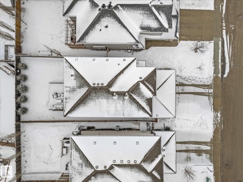 This property features a distinct roofline with multiple gables and visible roof vents - 13 Spring Link, Spruce Grove, AB - Outdoor