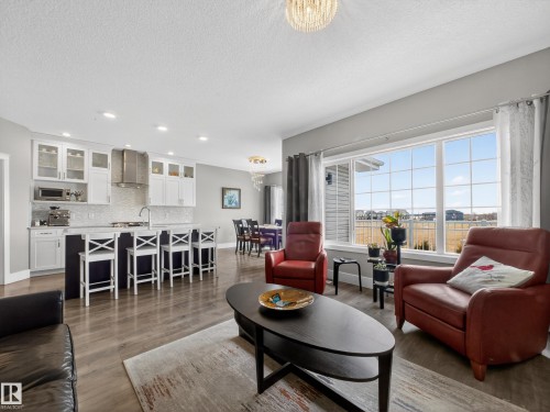1047 Coopers Hawk Link Link, Edmonton, AB - Indoor Photo Showing Living Room