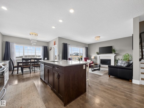 1047 Coopers Hawk Link Link, Edmonton, AB - Indoor With Fireplace