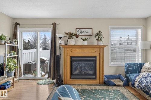 176 230 Edwards Drive, Edmonton, AB - Indoor Photo Showing Living Room With Fireplace