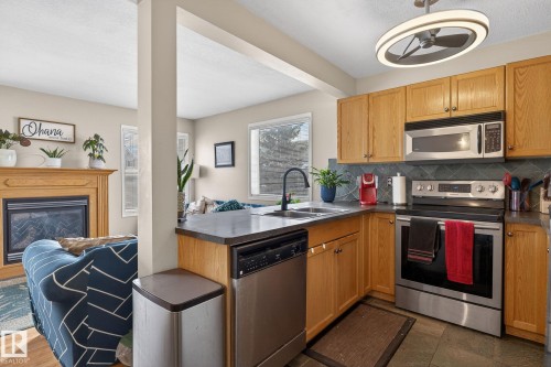 176 230 Edwards Drive, Edmonton, AB - Indoor Photo Showing Kitchen With Stainless Steel Kitchen With Double Sink